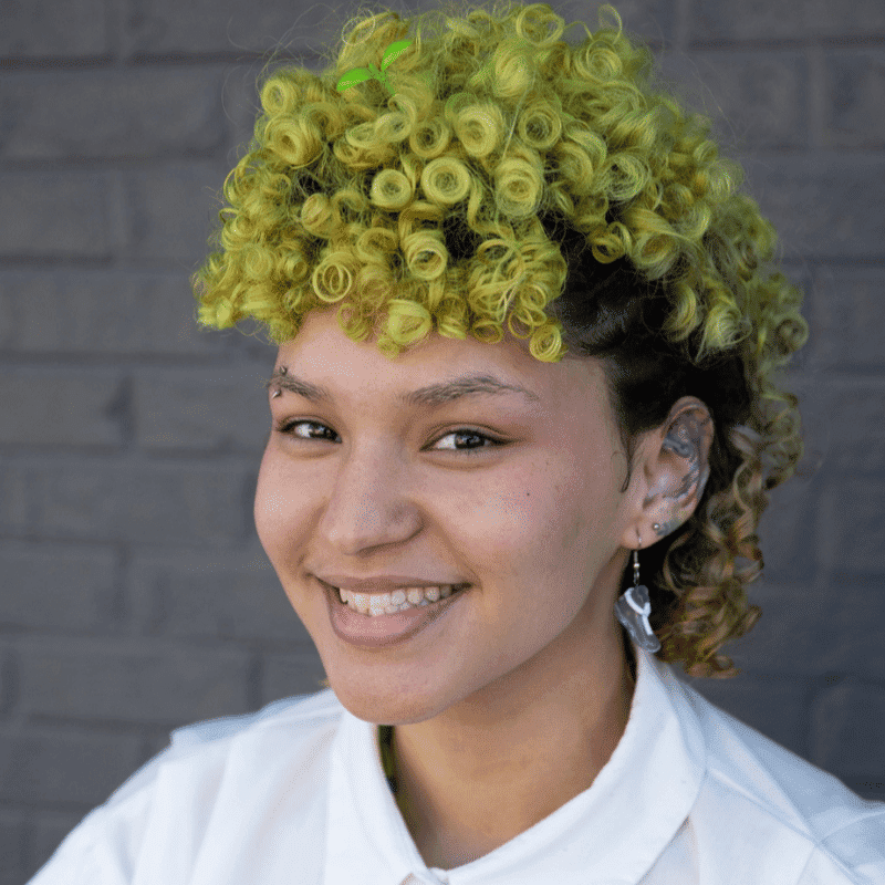 Portrait of Ohana, a professional stylist at Salon Ciseaux, showcasing their expertise and style.