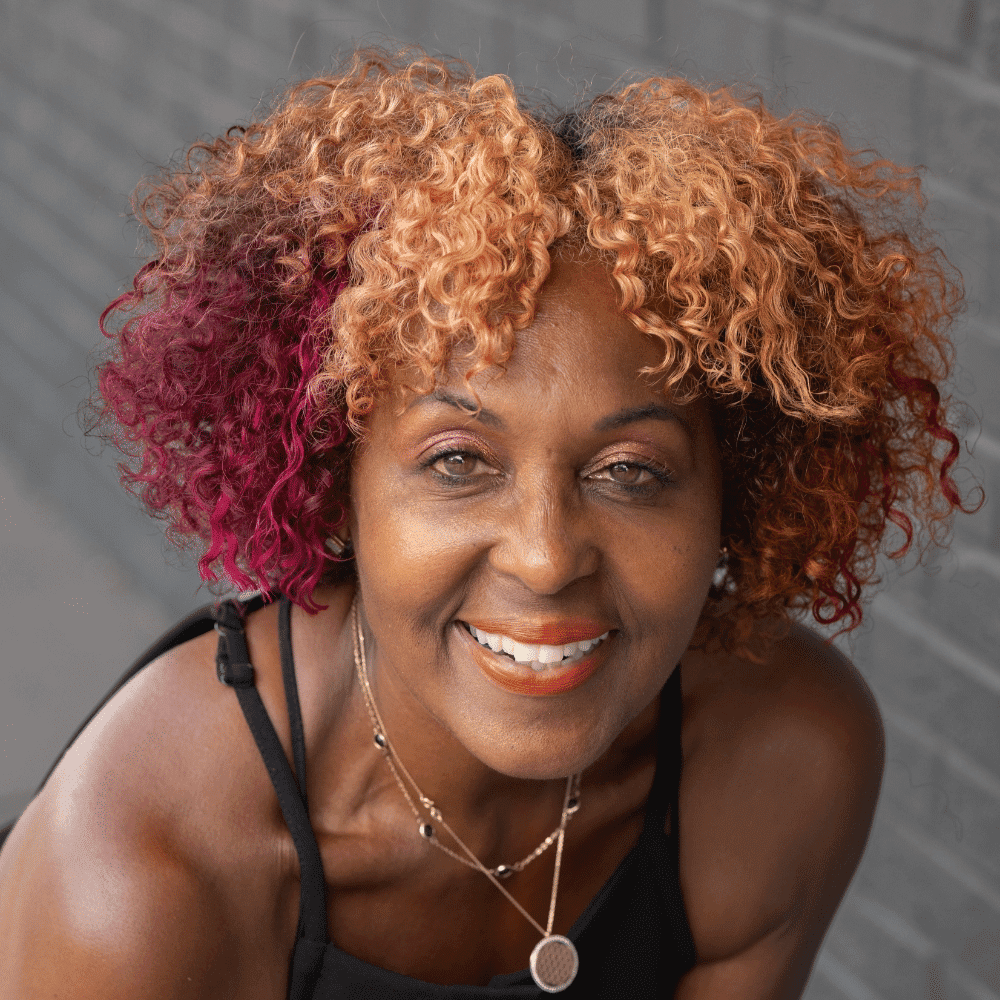 Portrait of Arlene Webber, a professional stylist at Salon Ciseaux, showcasing their expertise and style.